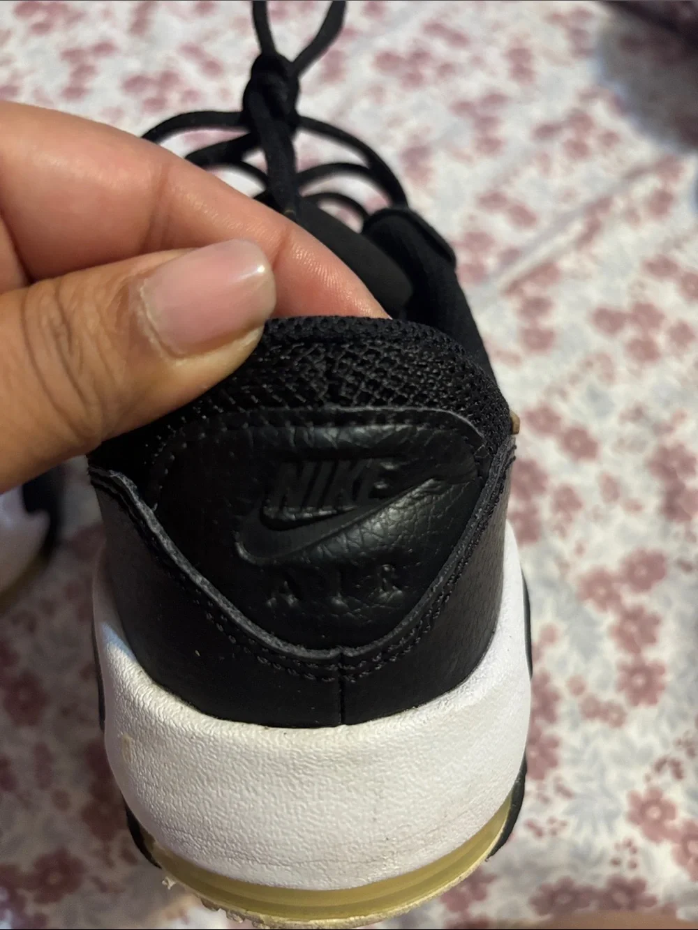 Nike Women's Black Sneakers with Subtle Gold Accent